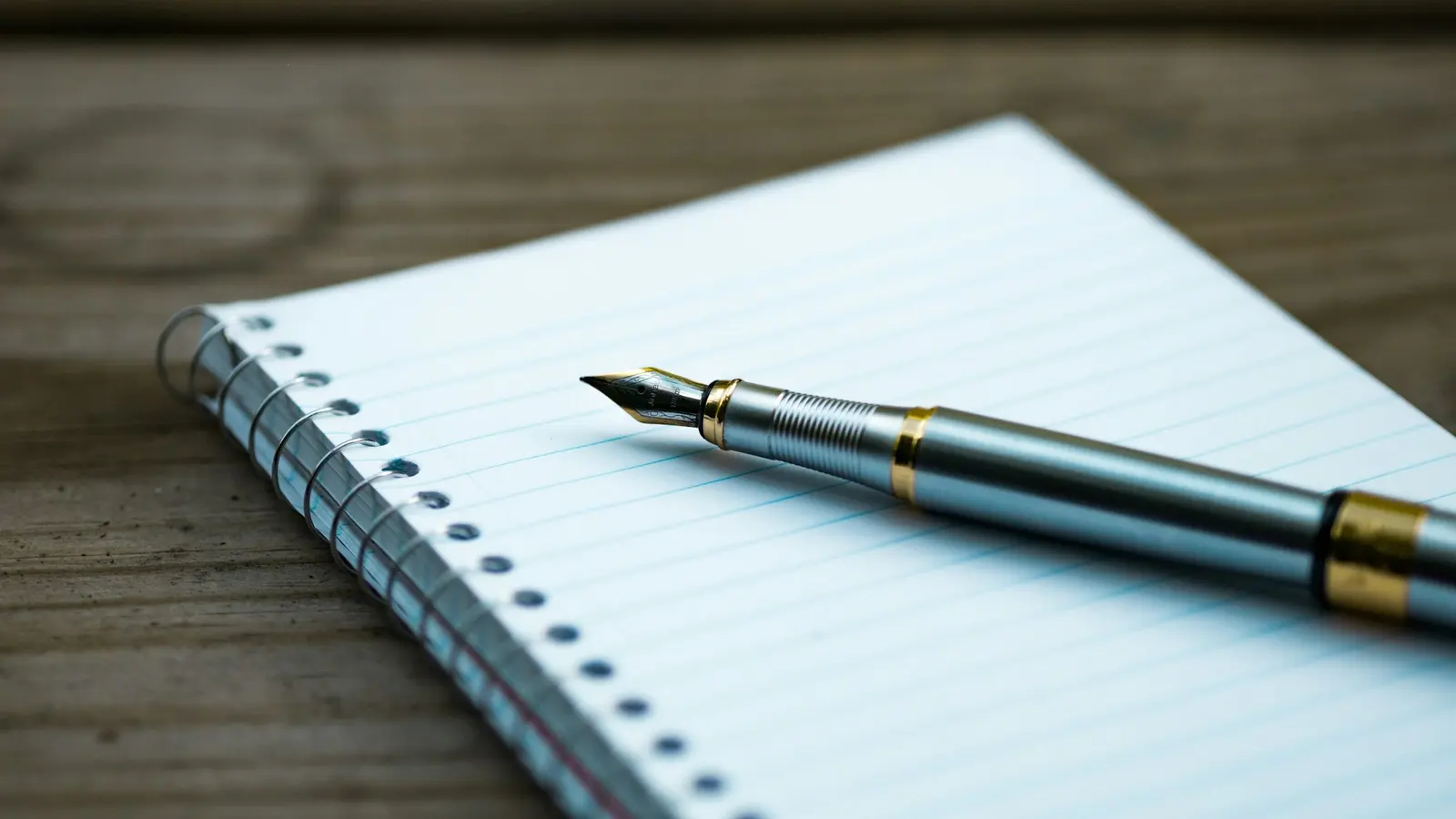 Keep a written log of every hypothesis and result. Photo by Aaron Burden on Unsplash