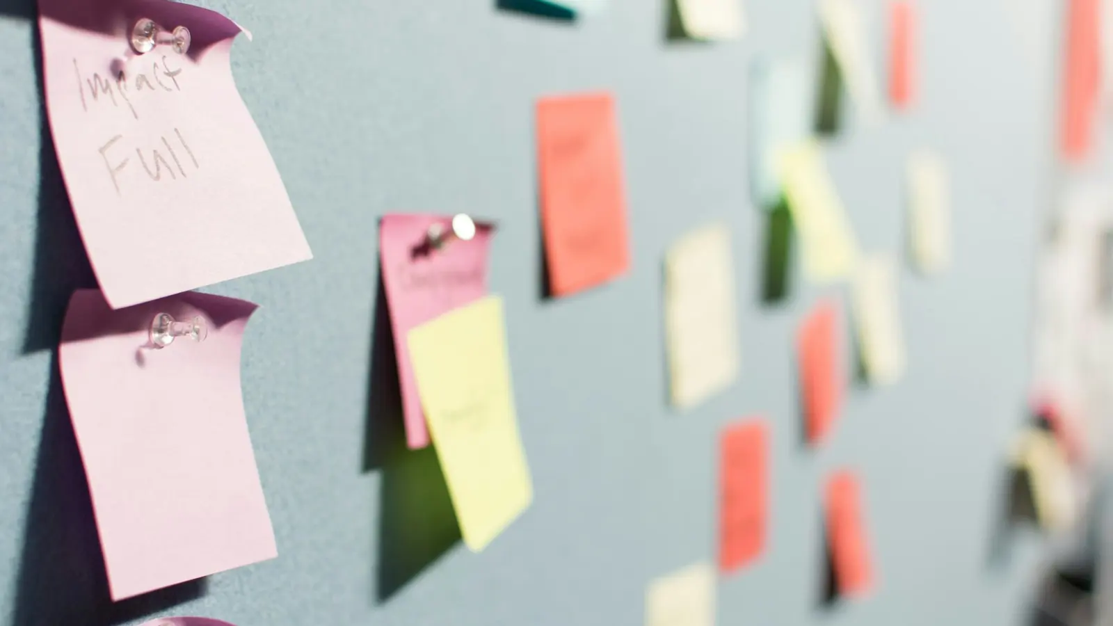 Planning conversion experiments on sticky notes. Photo by Patrick Perkins on Unsplash